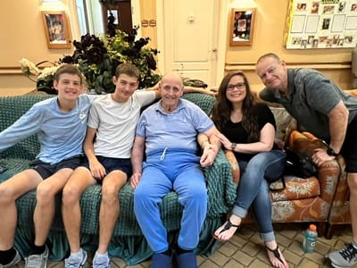 Residents and family members sitting together in a common area