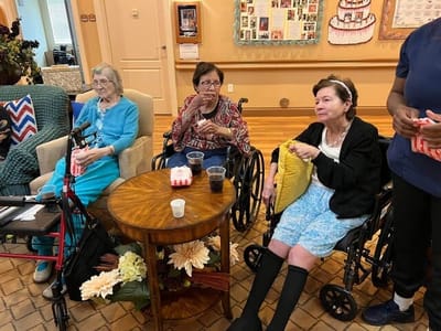 Residents enjoying snacks in a common area