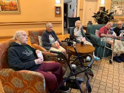 Residents enjoying snacks in a common area