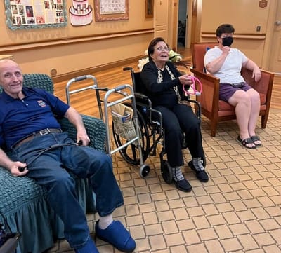 Residents and staff interacting in a common area