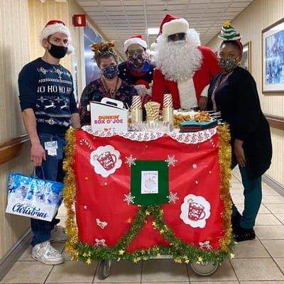 Staff celebrating Christmas in the facility's common area
