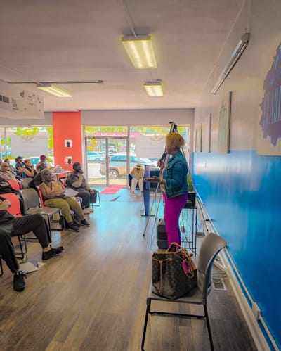 Residents enjoying an activity in a bright common area