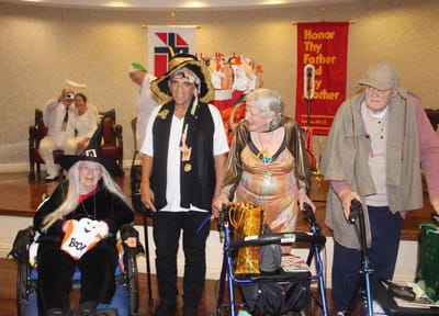 Residents participating in a festive event in the activity room