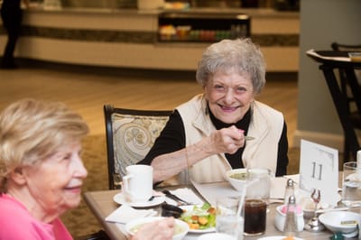 Residents enjoying a meal in the dining room