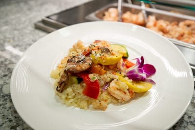 A beautifully plated seafood dish with vegetables