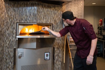Cook preparing food in the kitchen