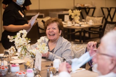 Residents enjoying a meal in the dining room