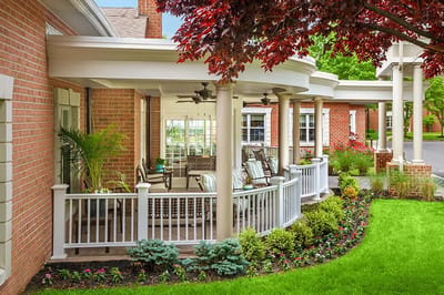 Outdoor patio area with seating and landscaping