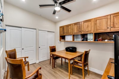 Bright common area with wooden cabinets and table