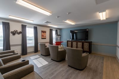 Common area with comfortable seating and entertainment system