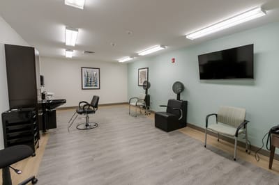 Interior of a salon area with styling chairs and equipment