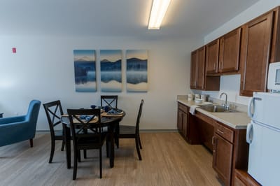 Cozy apartment interior with dining area and kitchenette