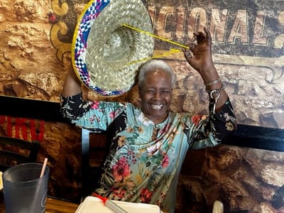 Resident enjoying a birthday celebration with a sombrero