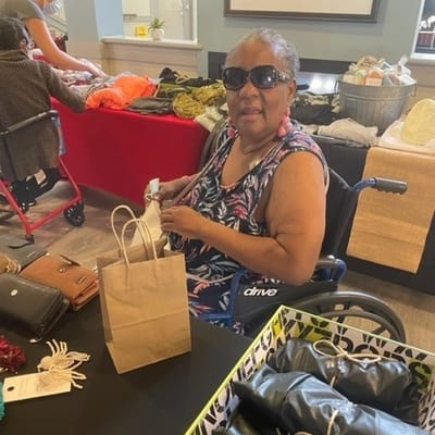 Resident enjoying a crafting activity in common area
