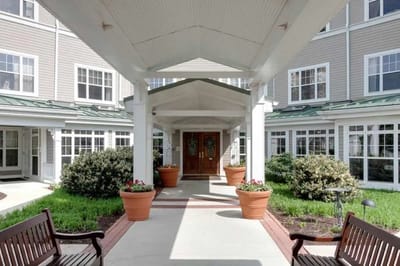 Entrance area of a senior living facility with planters