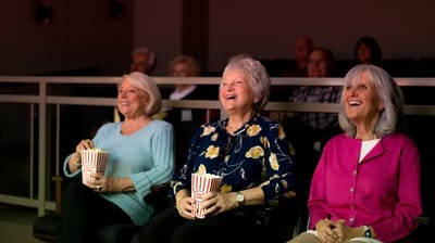 Residents enjoying a movie together.