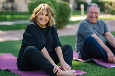 Residents participating in outdoor yoga activity.