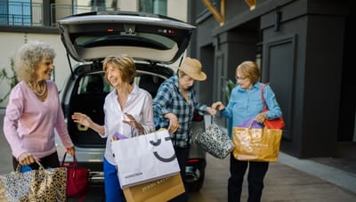 Residents enjoying an outing with shopping bags