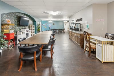 Lobby area with dining tables and seating