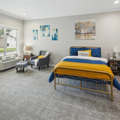 Cozy resident room with warm decor.