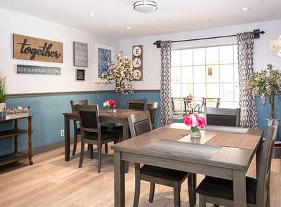 Bright dining area with tables and decor