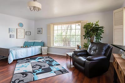 Cozy resident room with furniture and window view