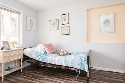 Cozy assisted living bedroom with decorative elements.