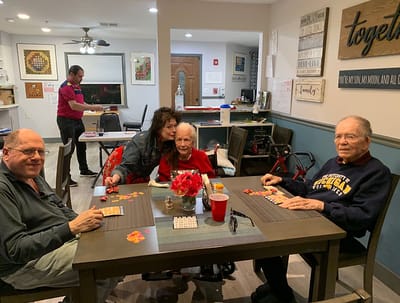 Residents playing a game in a common area.
