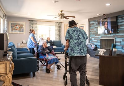 Residents and staff interacting in a common area.