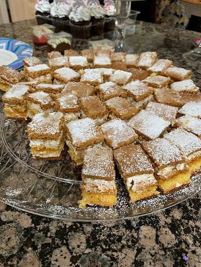 Plate of dessert squares on a table