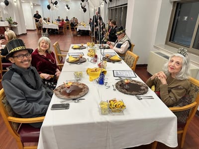 Residents celebrating at a festive dining table