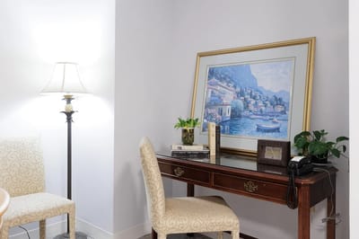 Cozy corner of an interior space with a lamp and artwork