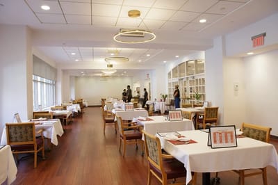 Bright dining area with tables set for meals
