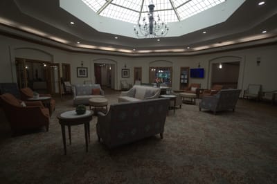 Common area with seating and chandelier