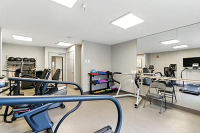 Interior view of a gym with exercise equipment.