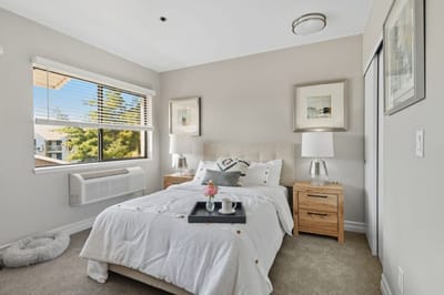 Cozy bedroom setup with warm natural lighting.
