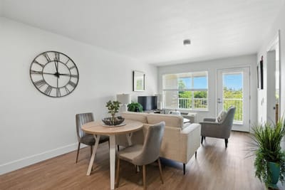Welcoming interior space with a dining table and seating.
