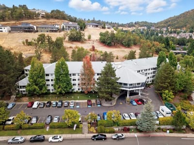 Aerial view of Solista Roseburg facility surrounded by trees.