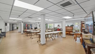 Bright common area with tables and seating