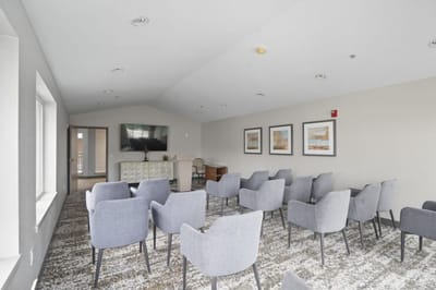 Interior common area with seating and television