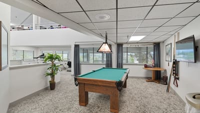 Interior view of a recreational area with a pool table.