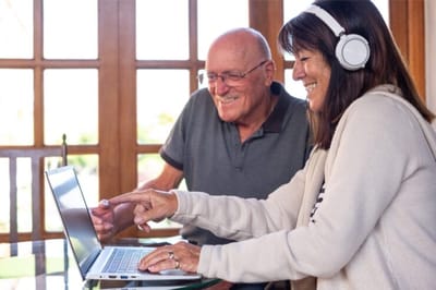 Residents enjoying a computer activity together.
