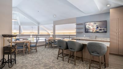 Common area with seating and a large TV