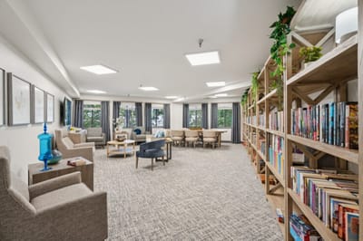 Inviting common area with bookshelves and seating.