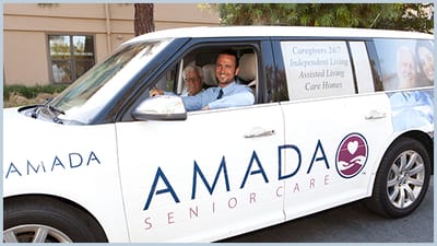 Staff member driving a facility transport van