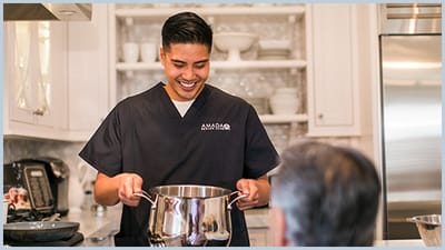 Staff member preparing food in the kitchen