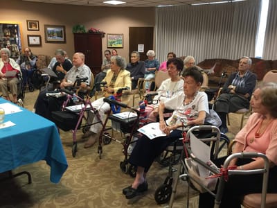 Residents participating in a community event in the common area