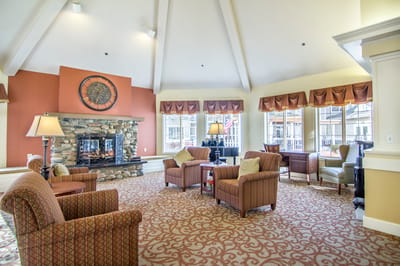 A cozy common area with seating and a fireplace