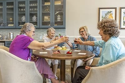 Residents enjoying drinks together in a common area