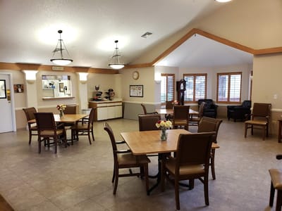 Bright common area with tables and chairs